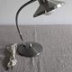 Articulated bedside lamp or wall light in aluminium, France circa 1960.