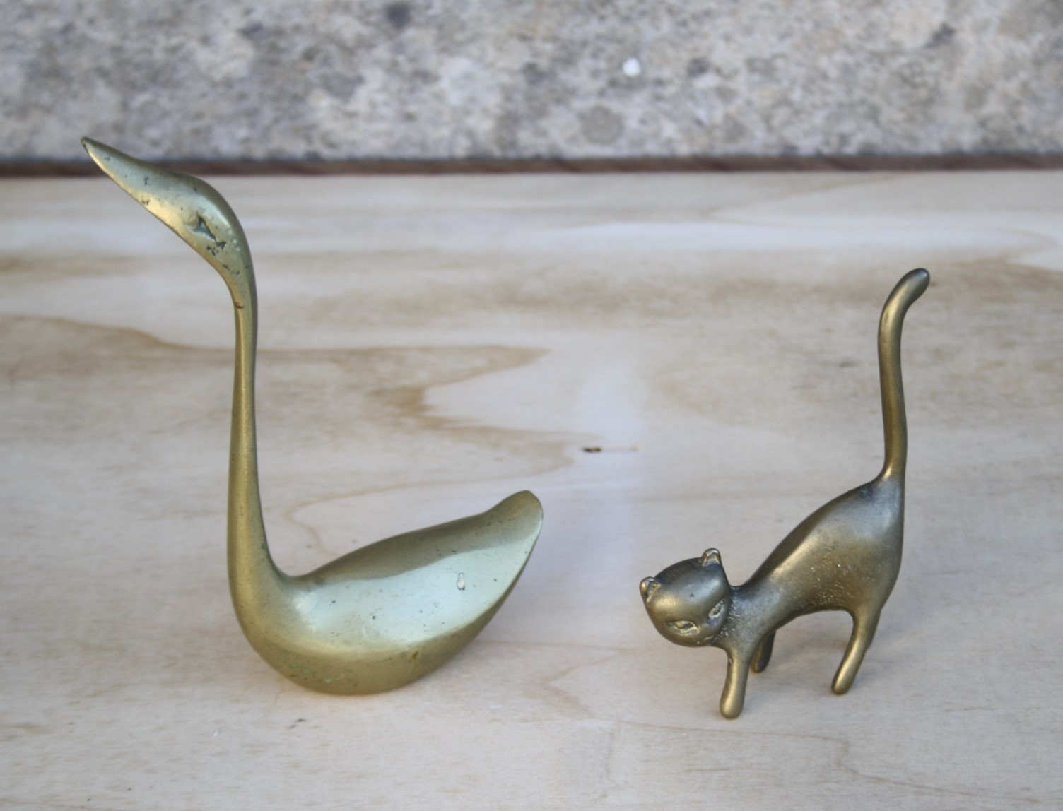 Cat and brass swan