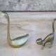 Cat and brass swan