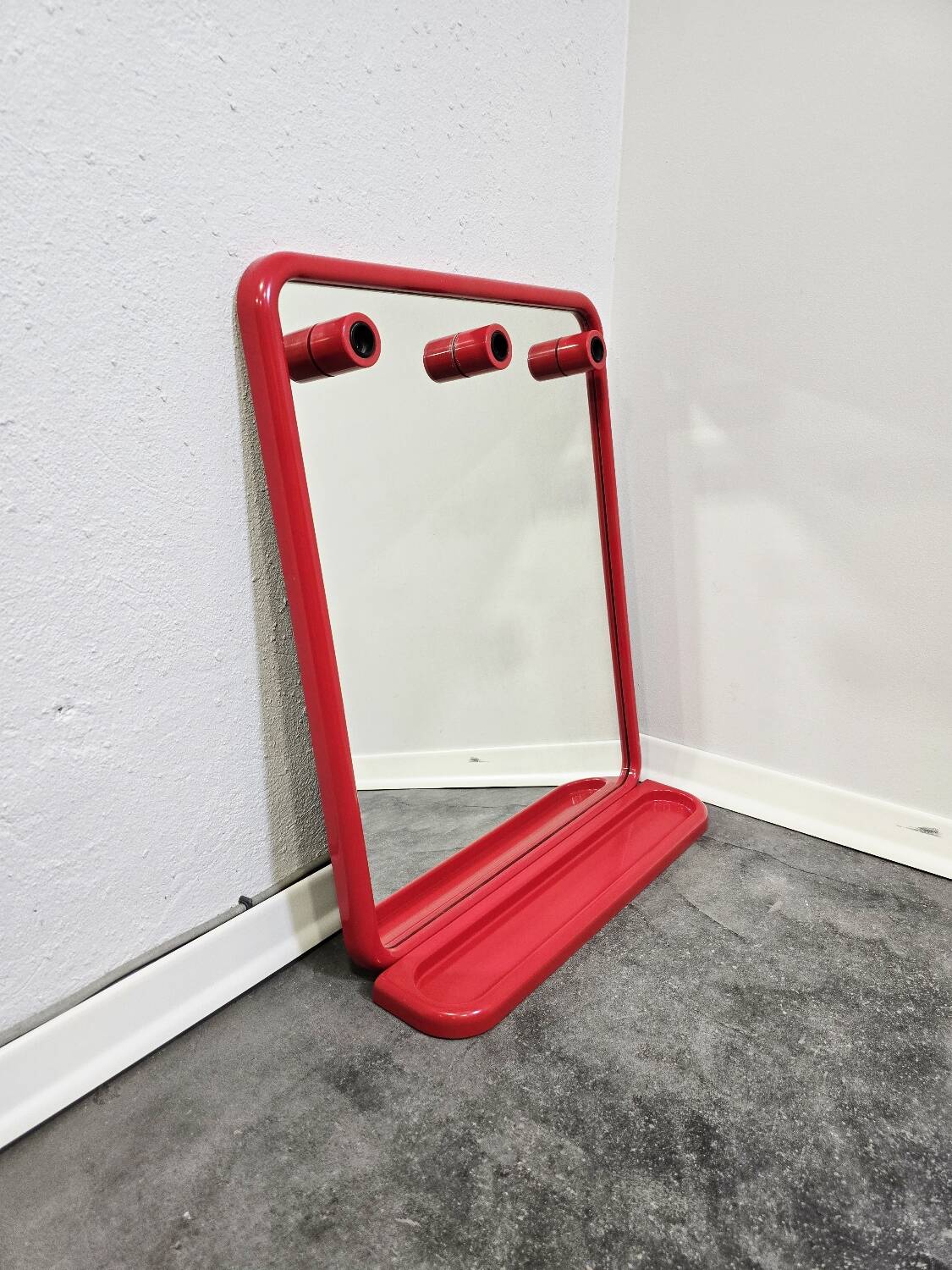 Mirror with a red shelf from the 90s.