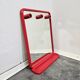 Mirror with a red shelf from the 90s.