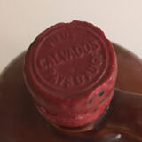 Bottle of Calvados labeled in sandstone