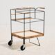 Metal cart with bamboo and wicker details.