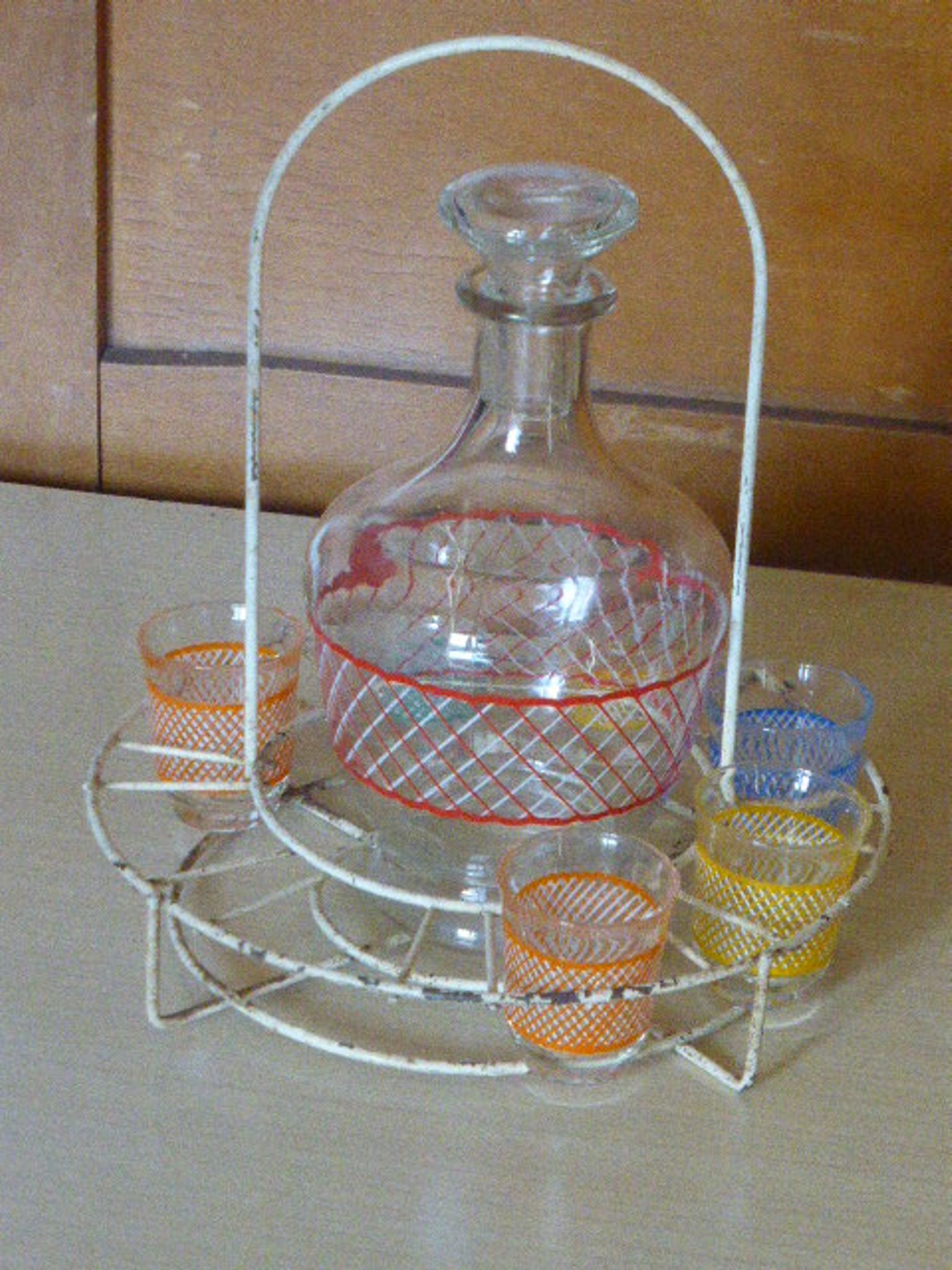 Service a Liqueur consisting of a metal servant, a carafe and 6 small vintage glasses 1950