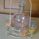 Service a Liqueur consisting of a metal servant, a carafe and 6 small vintage glasses 1950