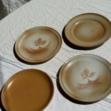 Set of 4 vintage stoneware plates, including 2 with floral motifs
