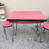 Table with two stools in red formica