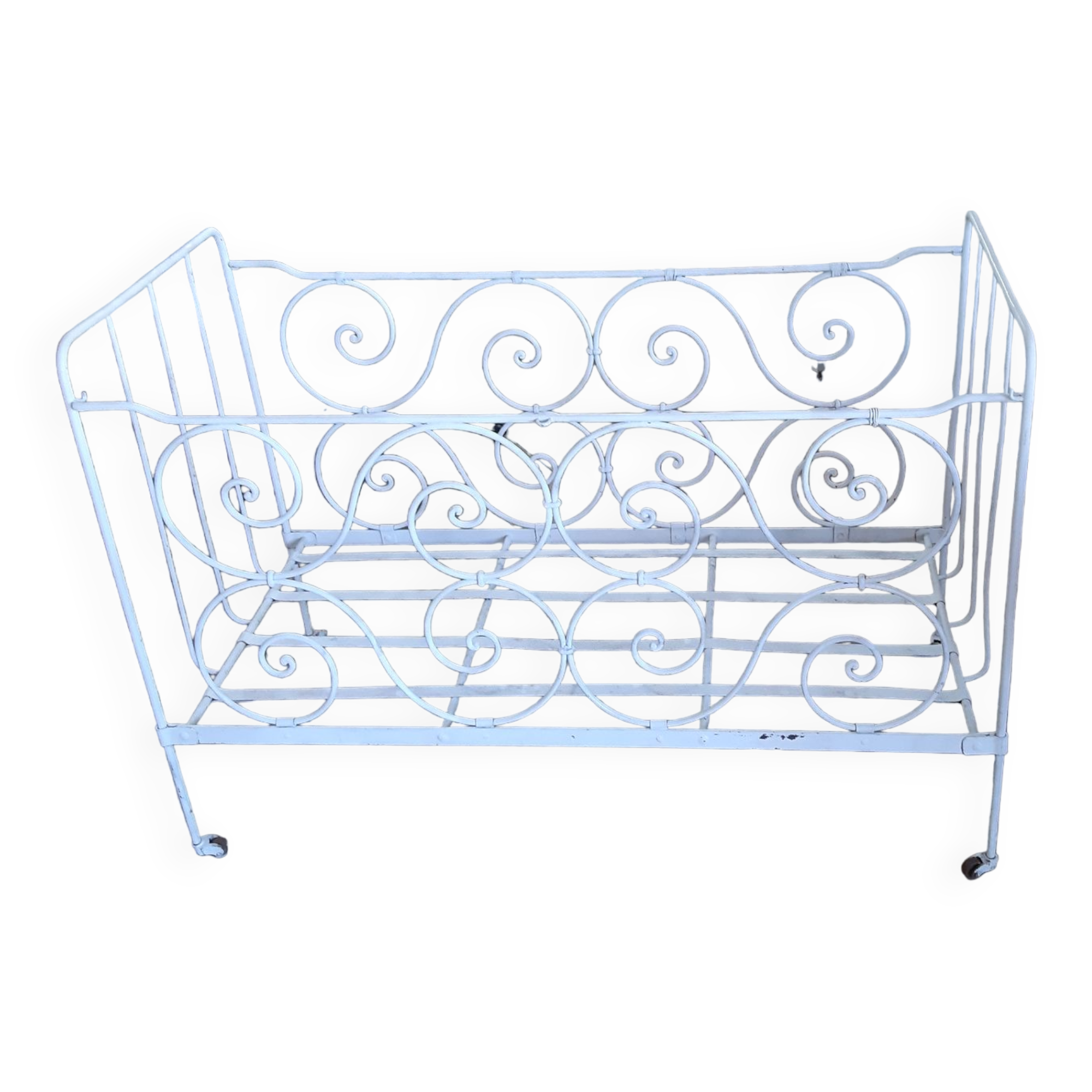Wrought iron baby bed. Or bench seat of your choice