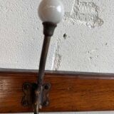 Vintage industrial wooden coat rack with porcelain hooks