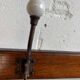 Vintage industrial wooden coat rack with porcelain hooks
