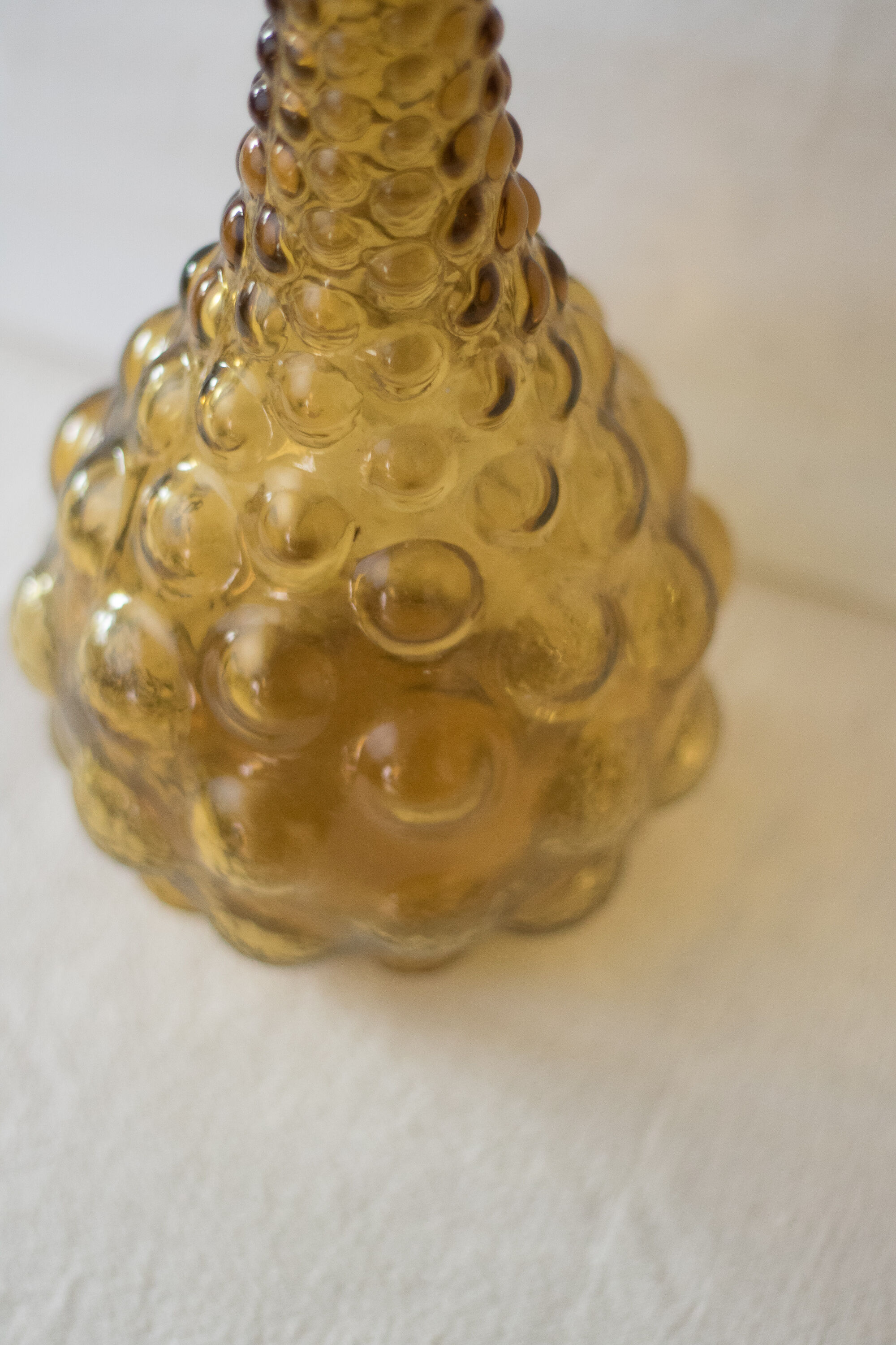 Green yellow bubble glass bottle