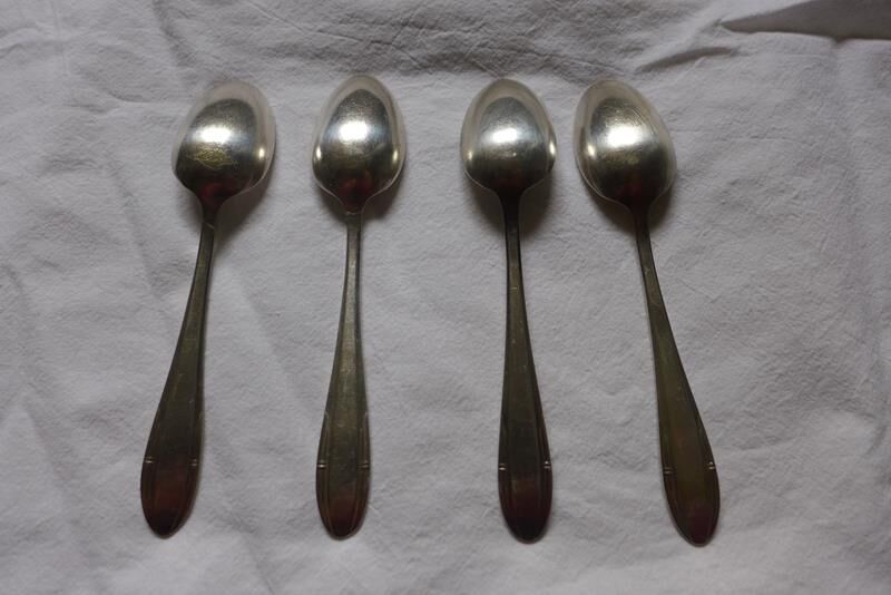 10 small silver spoons