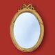 Antique oval mirror in gilded resin with Louis XVI style knot decoration