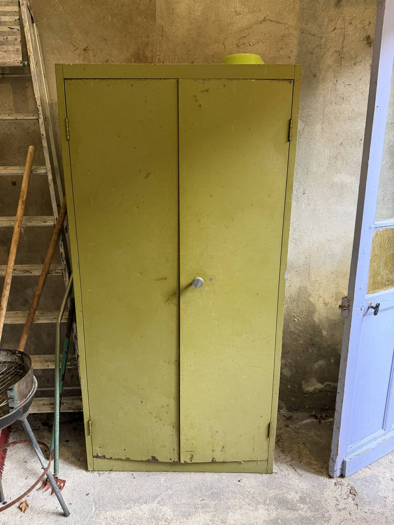Green metal wardrobe in military style