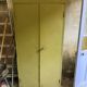 Green metal wardrobe in military style