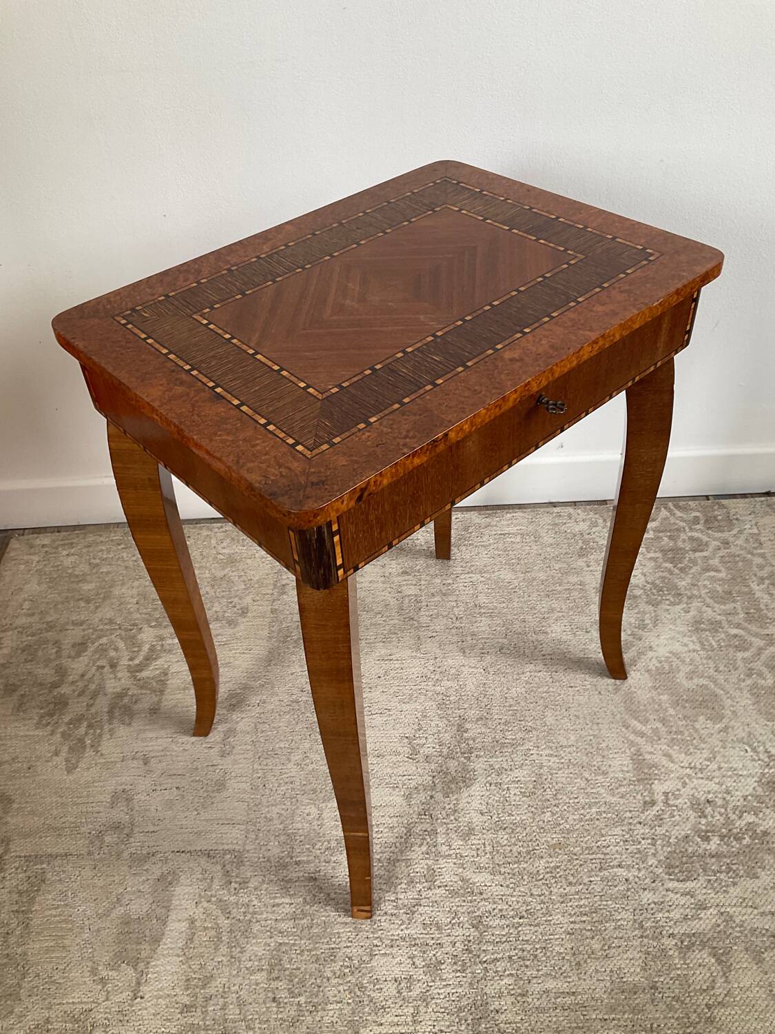 Small marquetry pedestal table with key storage