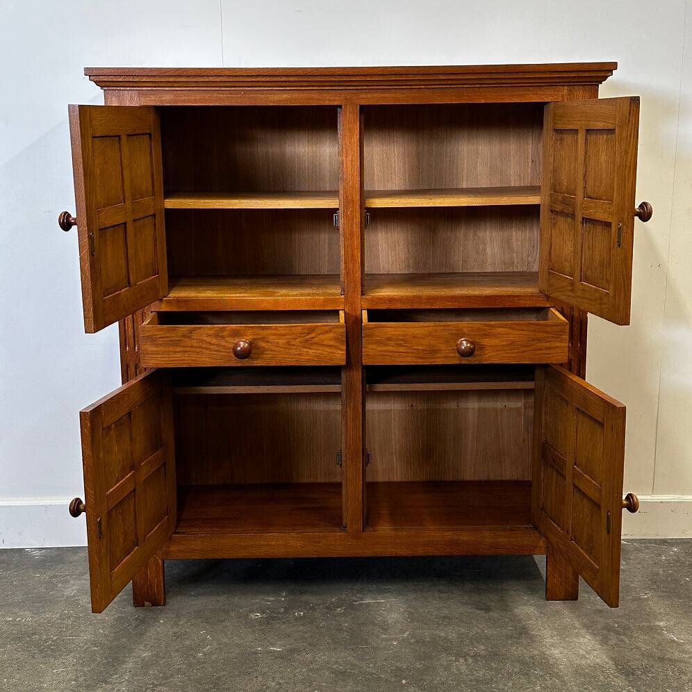 Artisan brutalist oak cabinet with turned knobs, France, 1970s