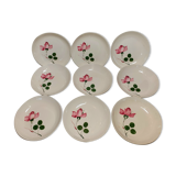 9 hollow plates caps in faience with decor of a rosebud