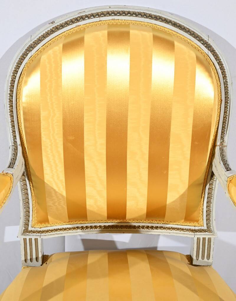 Pair of Cabriolet Armchairs, in rechampi wood, Louis XVI style – Late 19th century