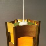 Older lamp in wood veneer, partially painted in green colour.