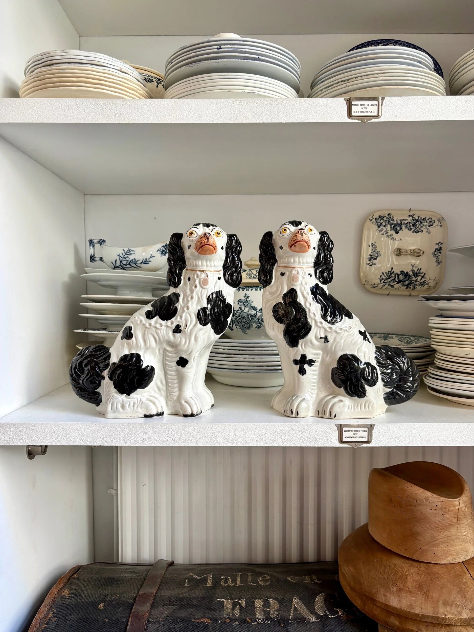 Pair of black Cavalier King Charles dogs in Staffordshire pottery, 19th century.
