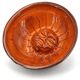 Mexican ceramic catchall in orange and black, 1970s sun face.