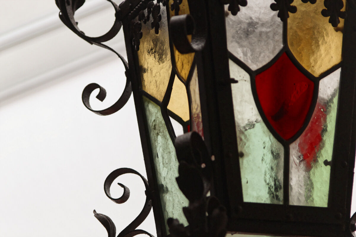 Wrought iron lantern and stained glass windows