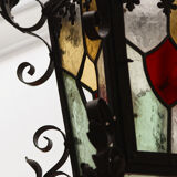 Wrought iron lantern and stained glass windows
