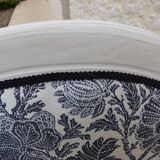 Voltaire style armchair covered in floral fabric in quality aged wood