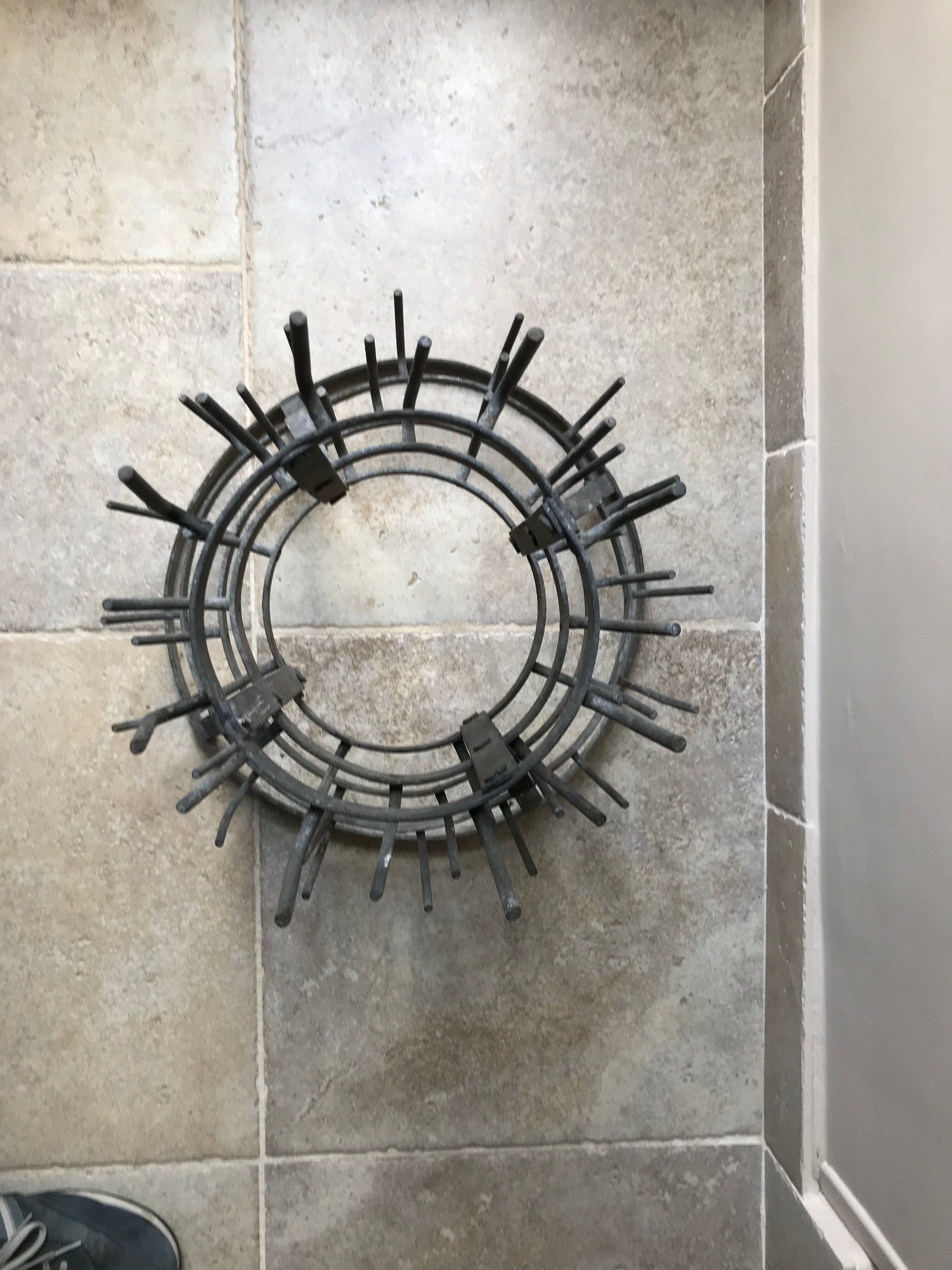 Old metal hedgehog bottle holder