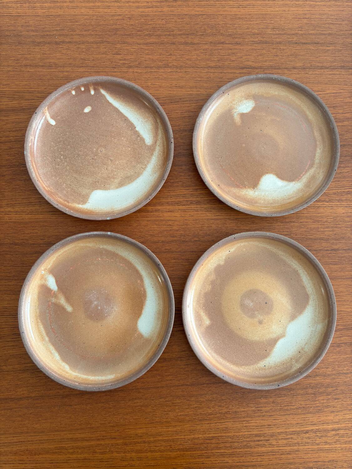 Lot of vintage 1970s beige stoneware dessert plates, handmade.