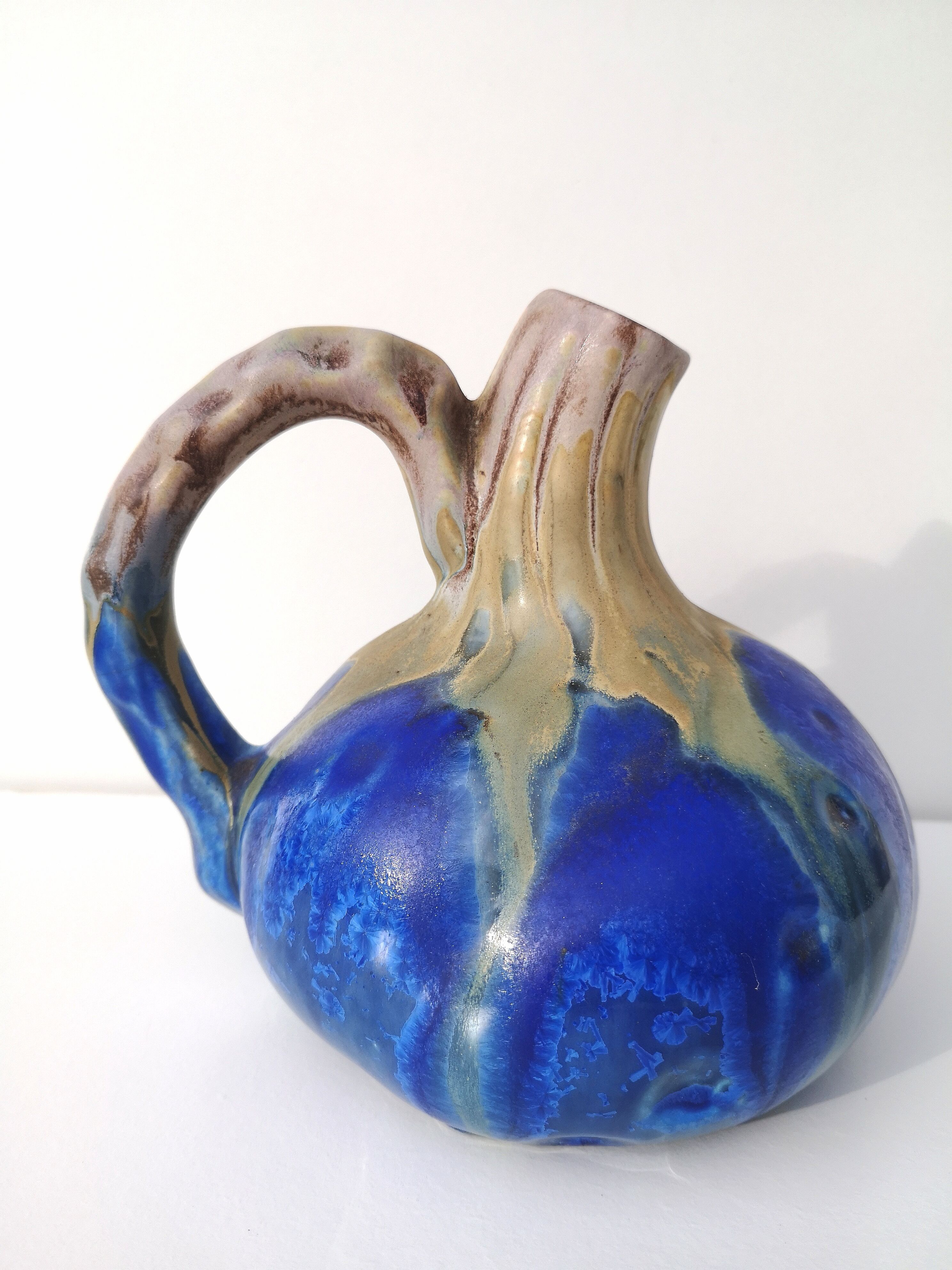 Vintage decanter in enamelled earthenware