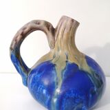 Vintage decanter in enamelled earthenware