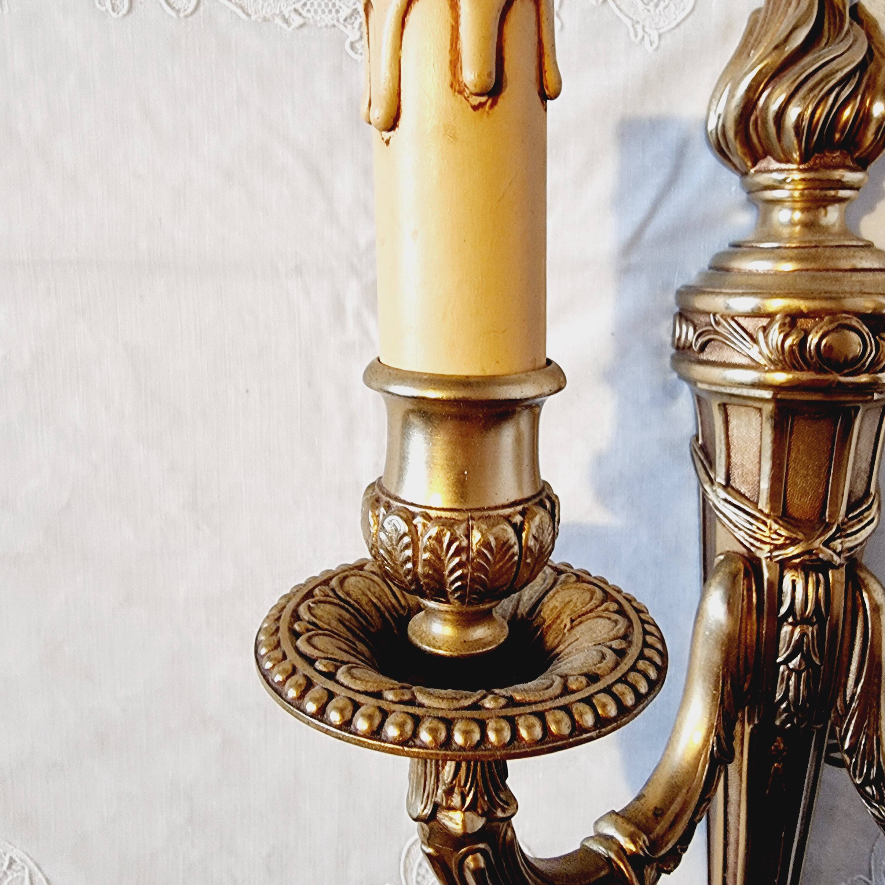 Pair of Louis XV style rocaille two-armed sconces in gilded bronze