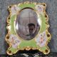 Porcelain mirror with cherub decorations circa 1900