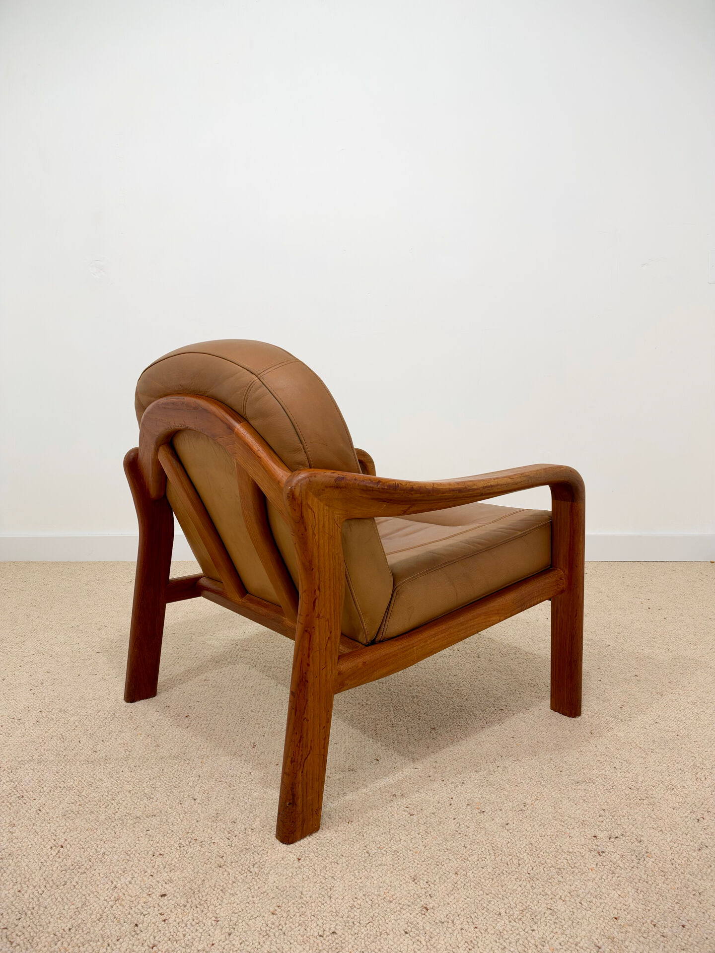 Vintage leather and wood armchair – 1970s