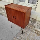 Piece of furniture on high compass feet