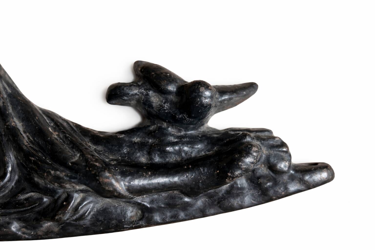 Pair of neoclassical fronton wall sconces in cast iron, elongated figures, 19th century.