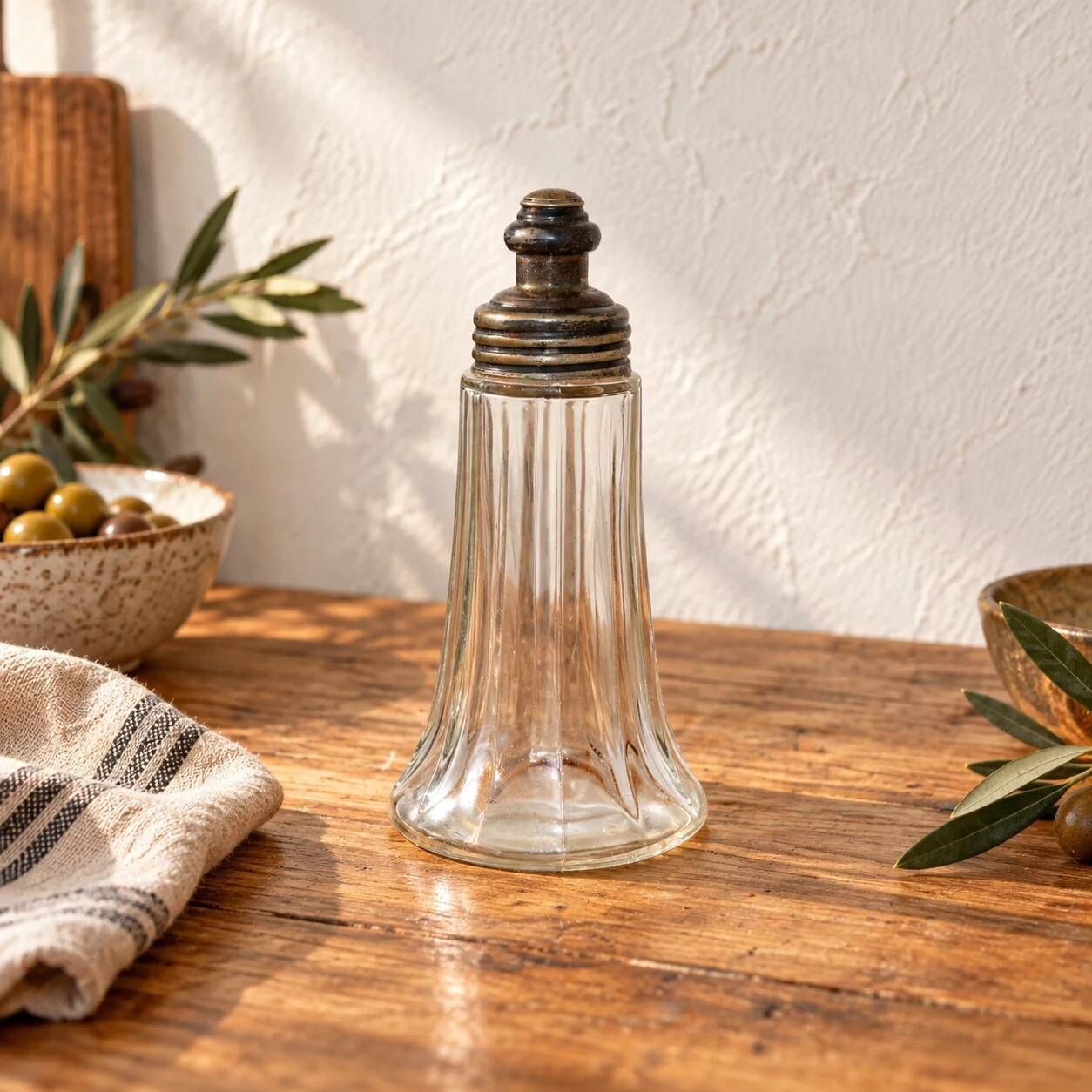 Vintage striped glass and patinated metal oil serving utensil.