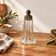 Vintage striped glass and patinated metal oil serving utensil.