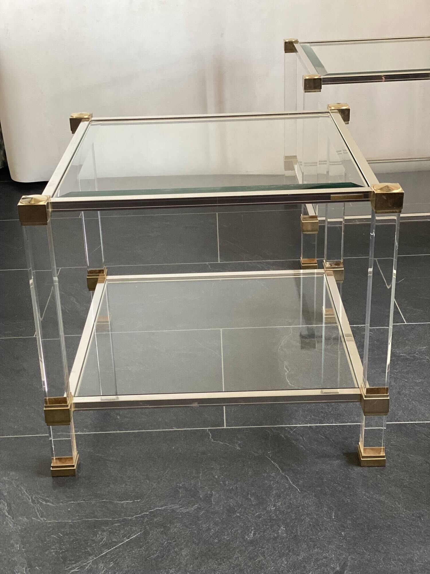 Pair of vintage and brass glass hollywood regency side tables by peter vandel