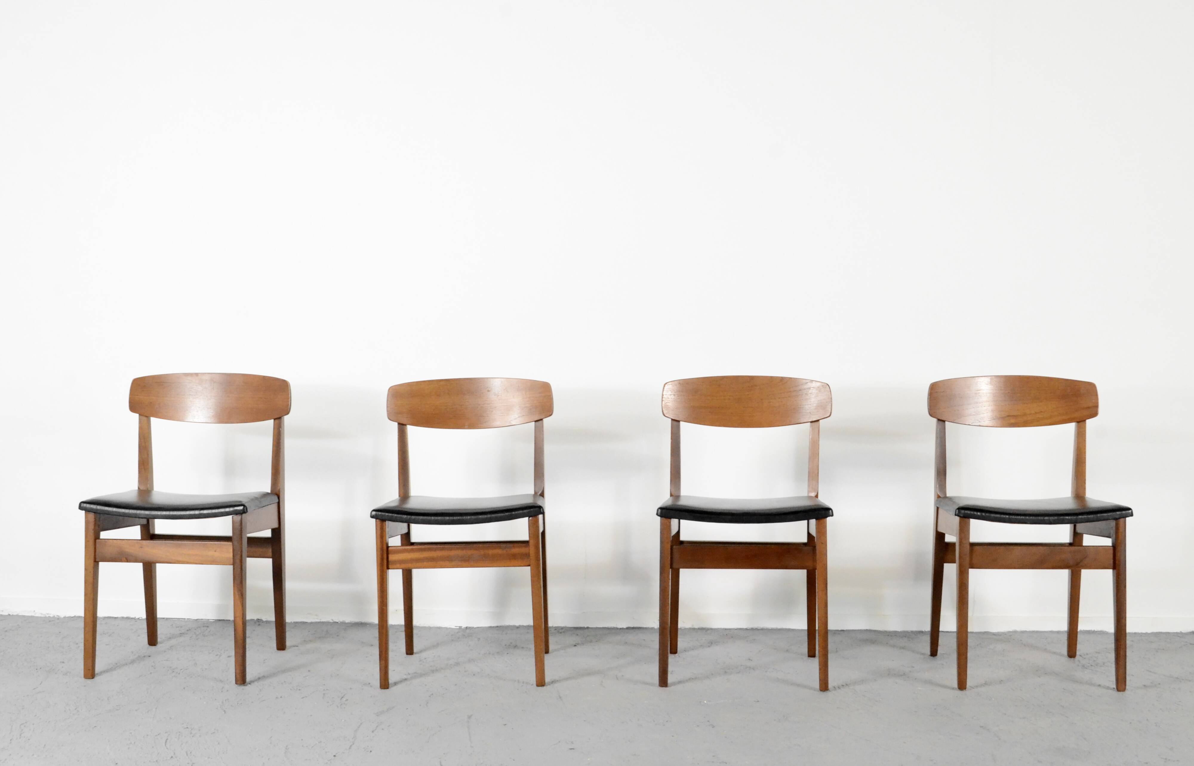Set Of 4 Midcentury Teak And Leatherette Chairs.