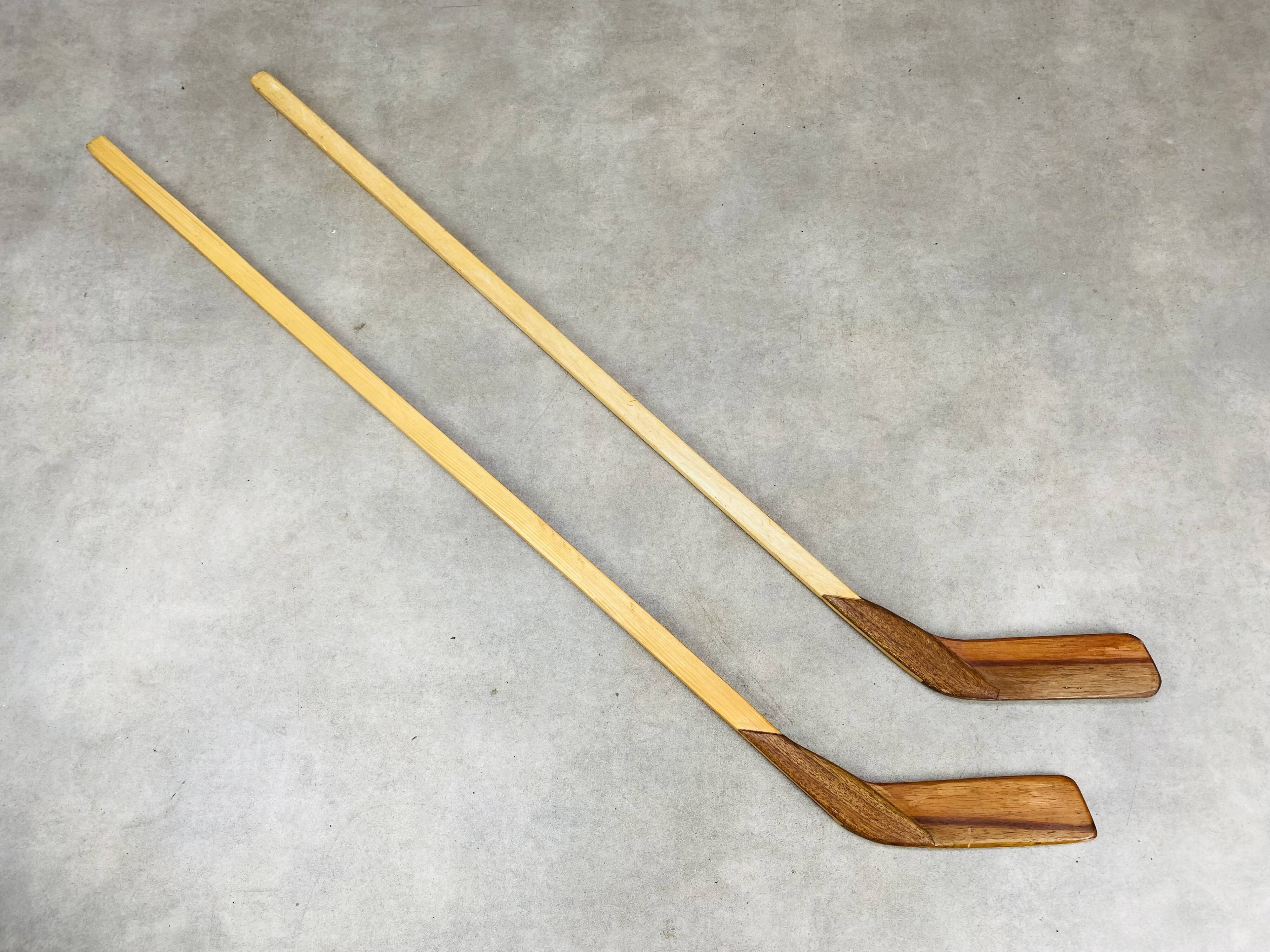 Pair of vintage wood hockey sticks