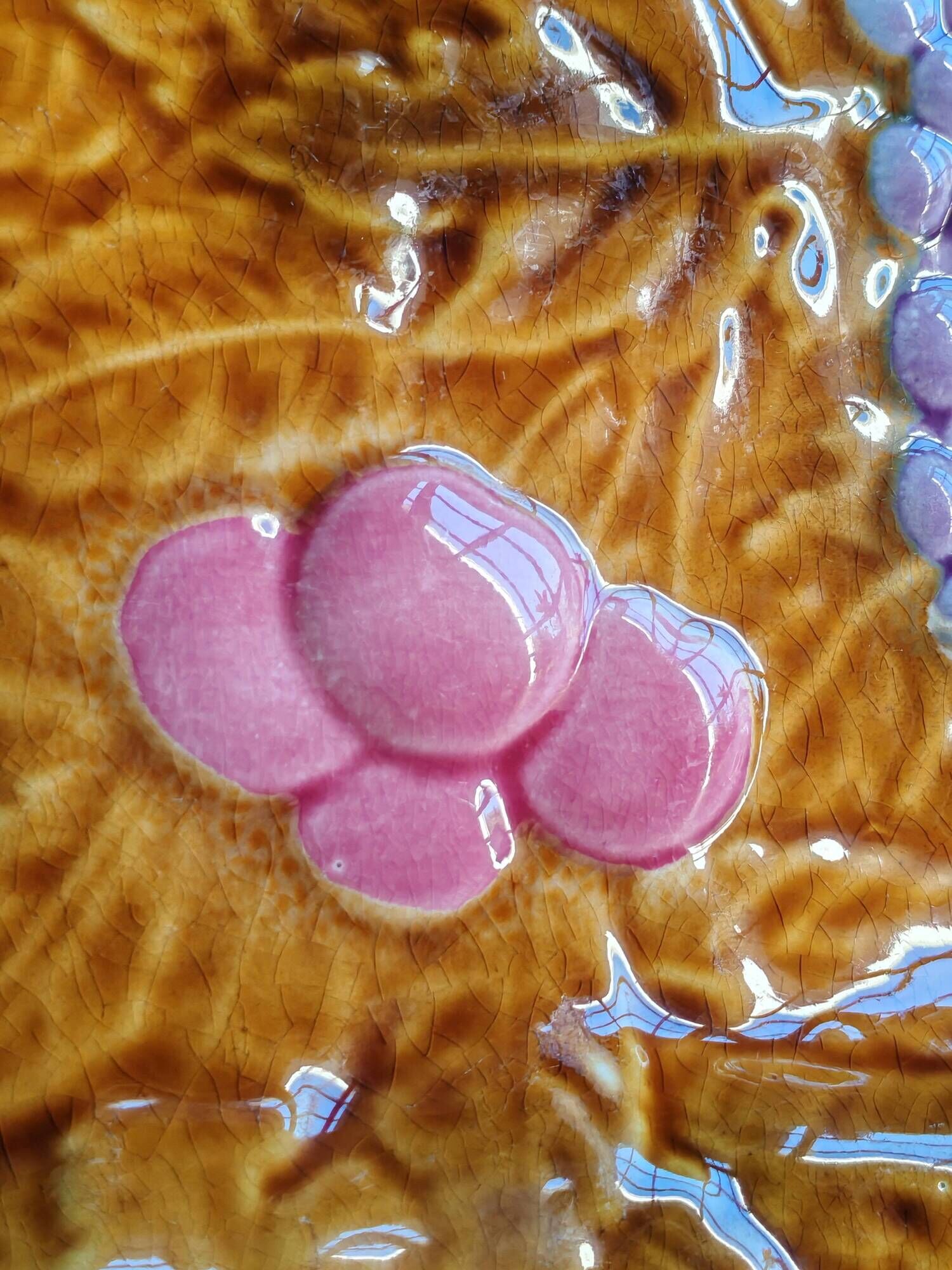 Vintage barbotine pocket dish from Salins les Bains, relief decoration of fruits.