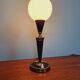 Black lacquered metal table lamp with satin white glass, 1950s.