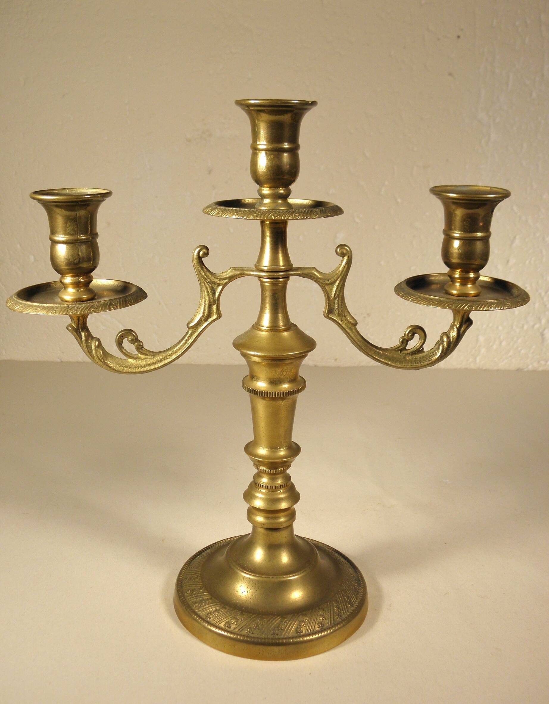 Three-light candlestick in gilded bronze