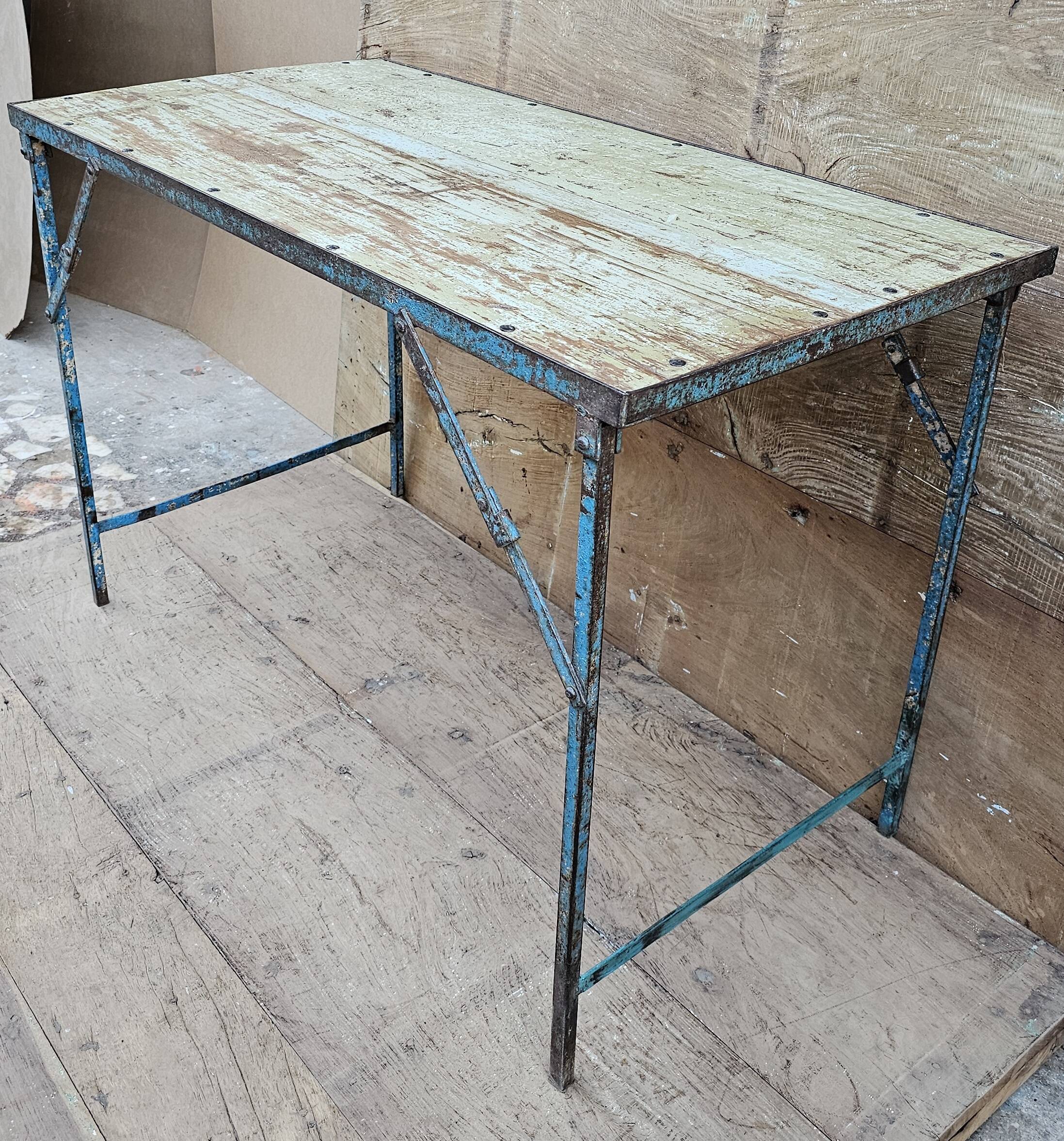 Old folding table in Burmese teak and steel