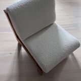 Vintage wooden armchair with curly seat