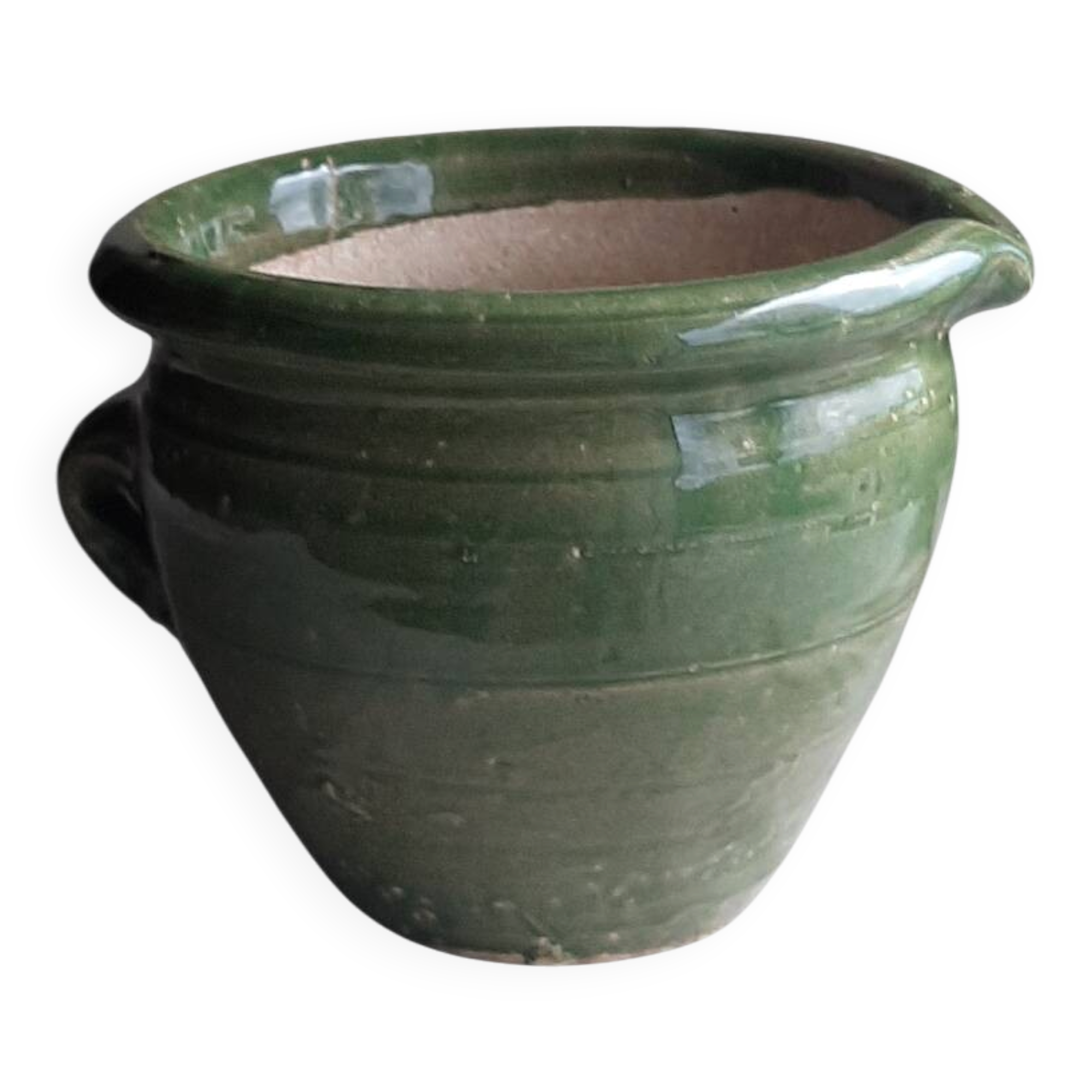 Glazed green terracotta pot.
