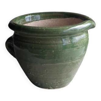 Glazed green terracotta pot.